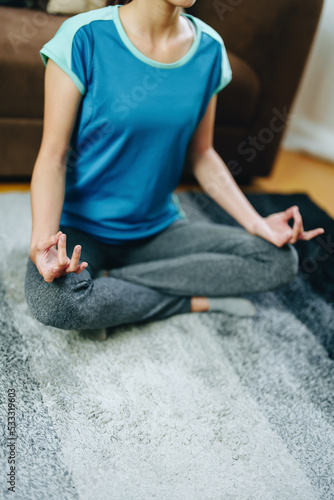 stress relief, muscle relaxation, breathing exercises, exercise, meditation, portrait of Young Asian woman relaxing her body from office work by practicing yoga by watching online tutorials