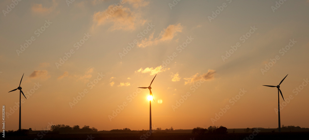 WInd mill in sunset.