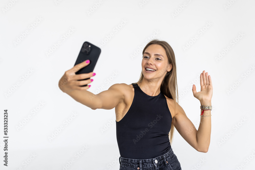 Happy young woman blogger influencer holding modern smart phone wave hand hello. Happy young woman blogger influencer holding modern smart phone wave hand hello.
