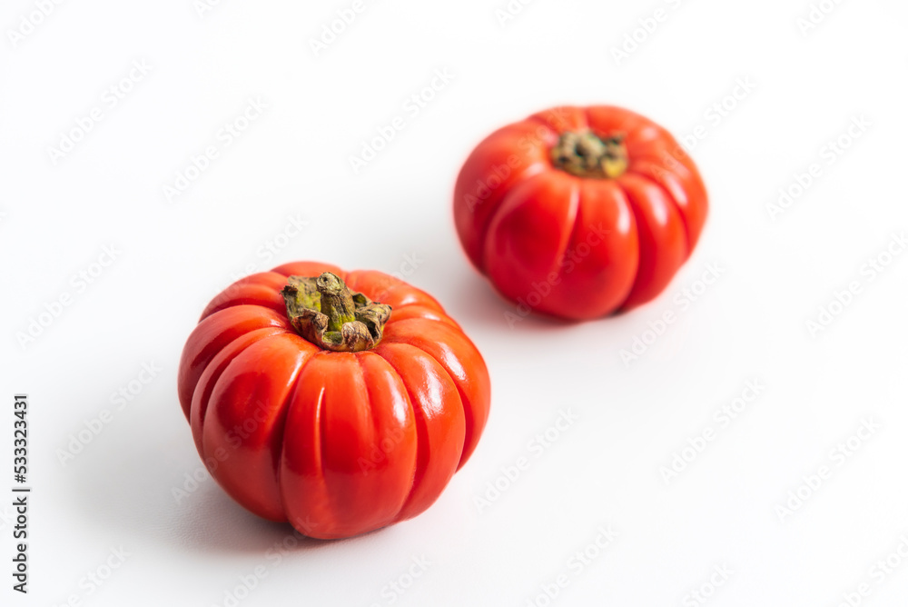 Two small tomato for decoration, on white background Two small tomato for decoration, on white background