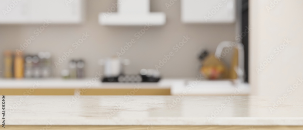 White marble tabletop with empty space over blurred modern home kitchen in the background White marble tabletop with empty space over blurred modern home kitchen in the background