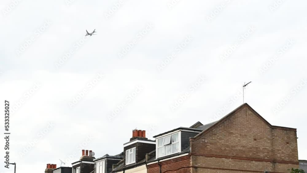 Plane flying back to Heathrow over Putney, London Plane flying back to Heathrow over Putney, London