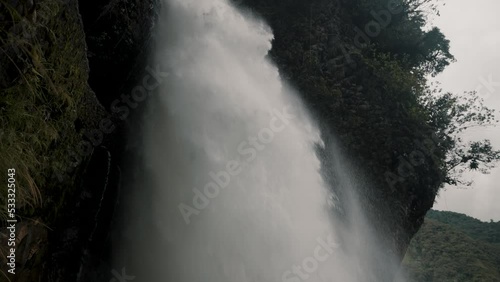 Powerful Water Cascade Of Devil's Cauldron In Baños de Agua Santa, Ecuador - low angle