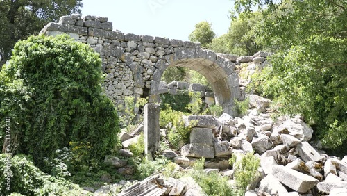 Heritage ruins sarnic in ancient city of Termessos in Taurus Mountains, region of ancient Pisidia. Archaeological sites of Turkey photo