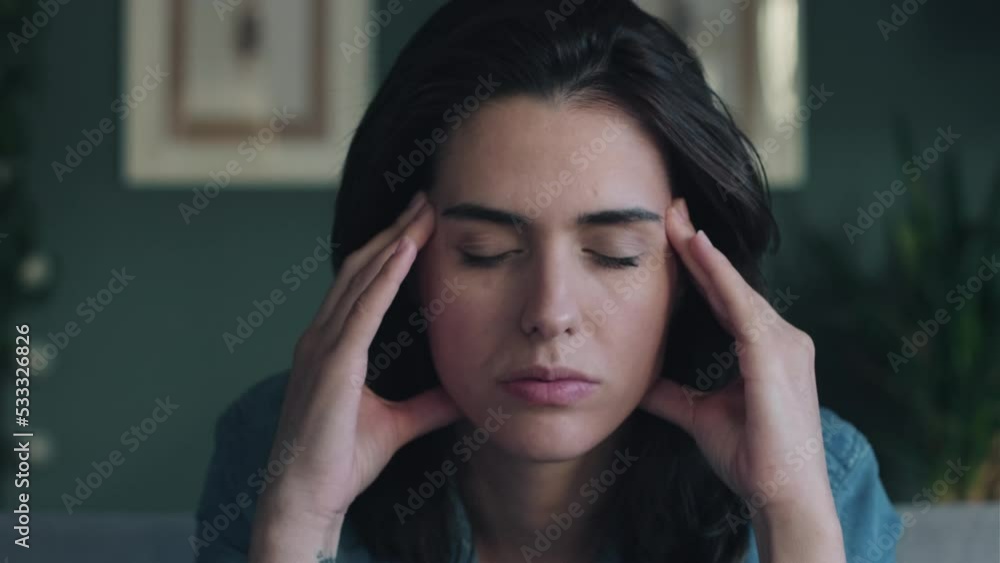 Video of depressed woman sitting on the coach at home. Video of depressed woman sitting on the coach at home.
