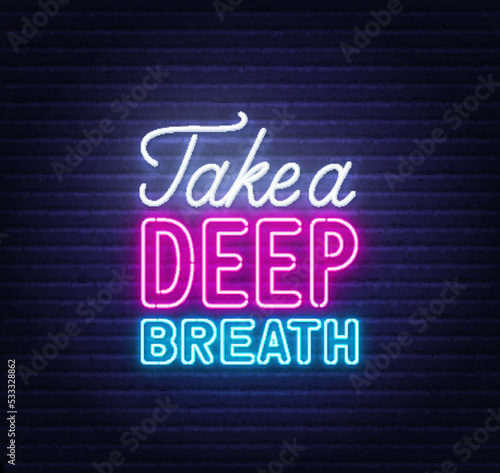Take a Deep Breath neon quote on brick wall background.