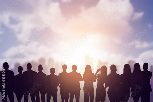 Creative image of silhouettes of businesspeople standing together on abstract background