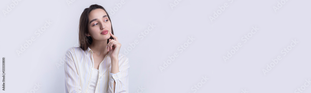 Portrait of a beautiful young woman thinking, isolated on white background Portrait of a beautiful young woman thinking, isolated on white background