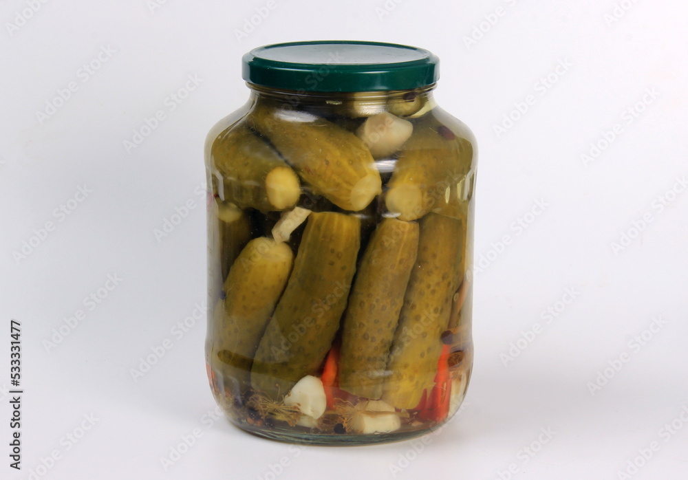 Glass jar with pickles on a white background Glass jar with pickles on a white background