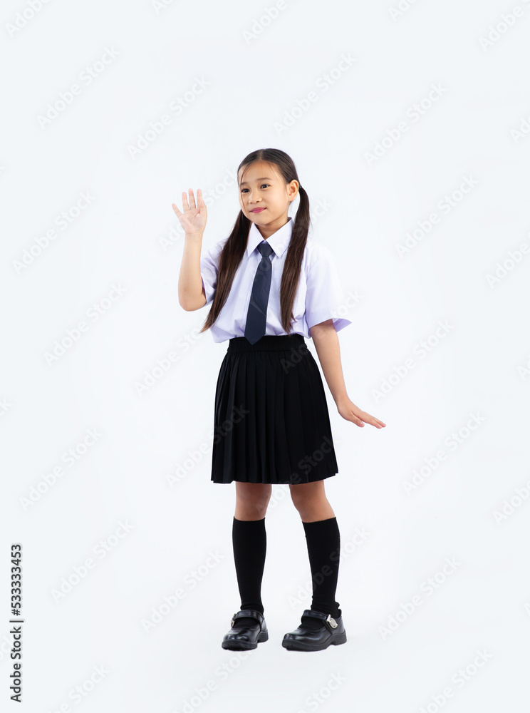 Back to school, junior school international student in uniform posing on white background. Back to school, junior school international student in uniform posing on white background.