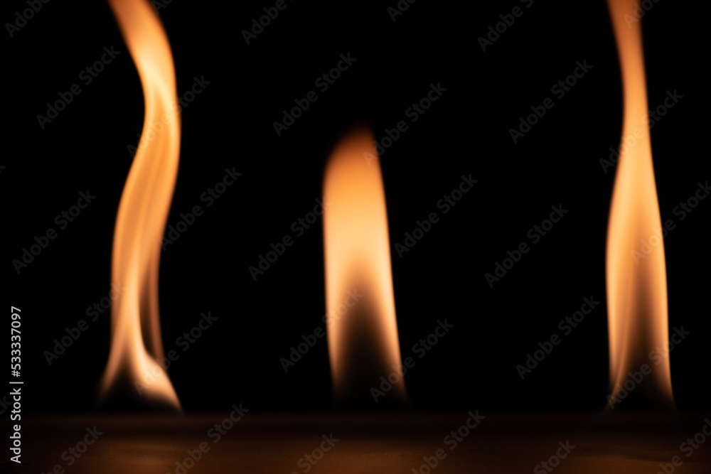 burning power of the flame, Flames, and burning sparks close-up, fire patterns, the glow of fire in the dark burning power of the flame, Flames, and burning sparks close-up, fire patterns, the glow of fire in the dark