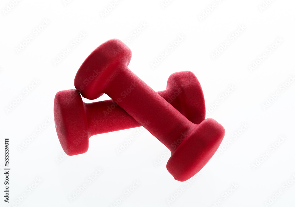 Pair of red dumbbells isolated on white Pair of red dumbbells isolated on white