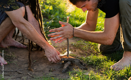 Foto Fire making in the wild (wilderness survival)
