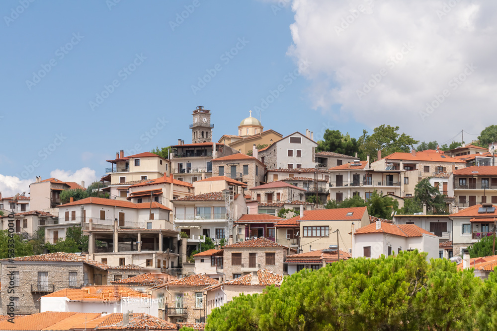 Arachova village in Greece with the clock on the top.
