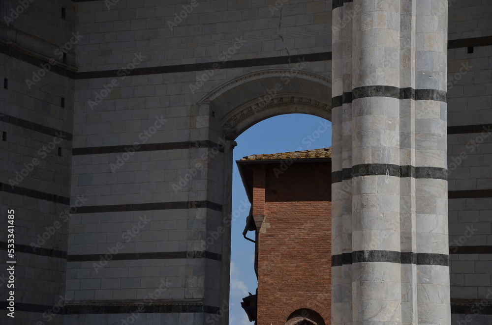 Fototapeta premium The beautiful countryside and town of Siena in Tuscany on a bright summer day with its typical Tuscan medieval style