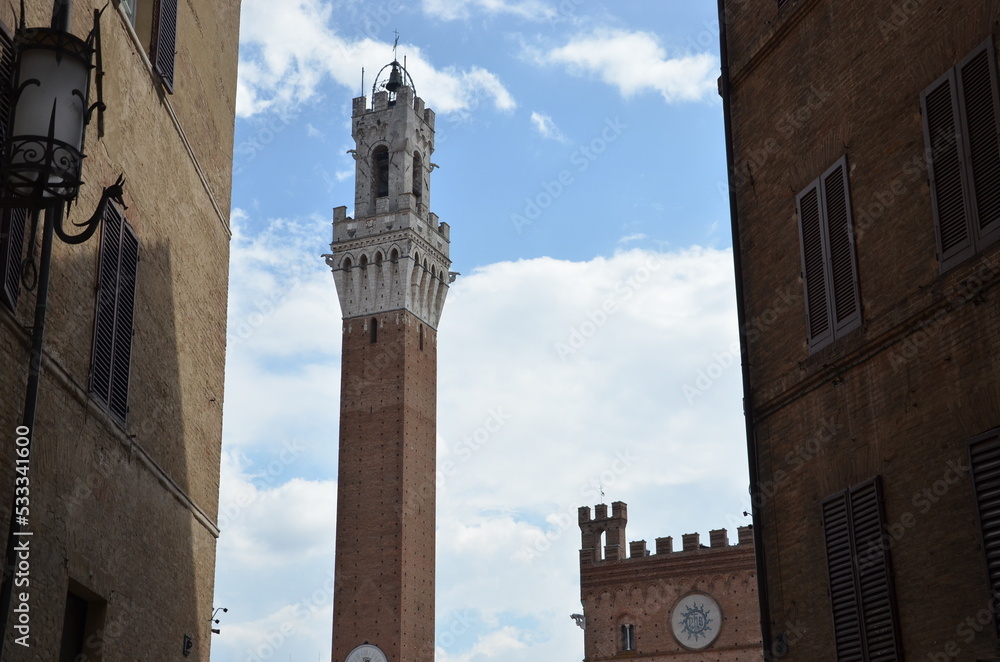 The beautiful countryside and town of Siena in Tuscany on a bright summer day with its typical Tuscan medieval style