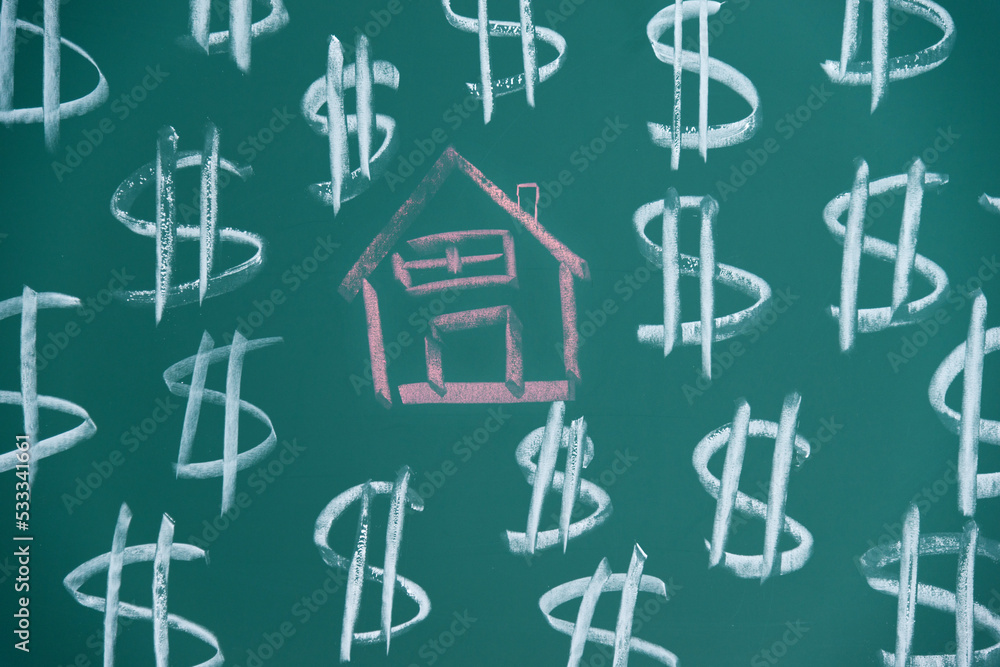 Drawing money and house on blackboard