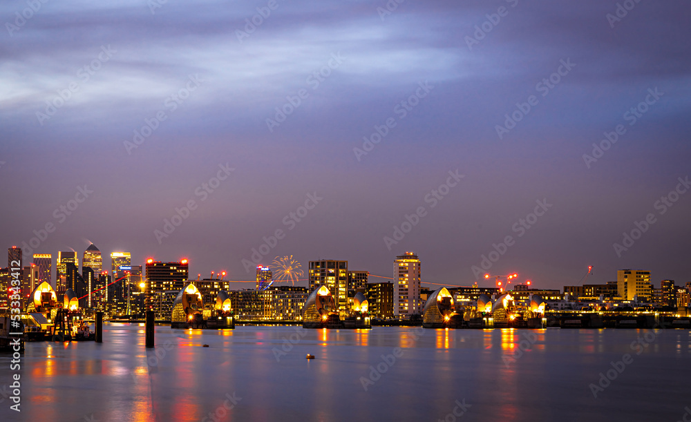 Long exposure view of Canary Wharf and Thames barrier in London