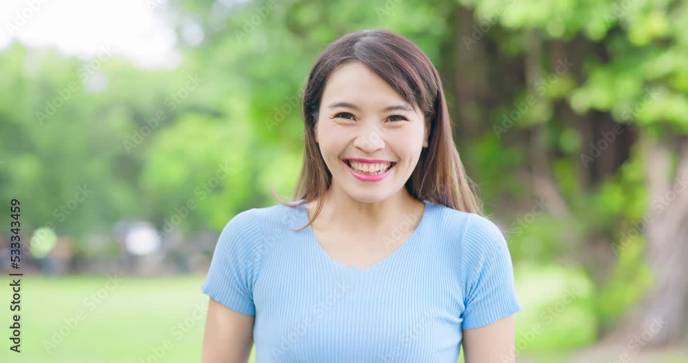 Asian woman smile at you