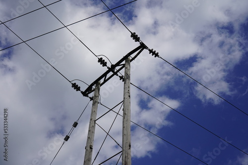 Wallpaper Mural Looking up at power pylons with blue sky and clouds background Torontodigital.ca