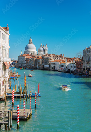 Gondolas and boats sailing down the Grand Canal in Venice. Italy, 2019