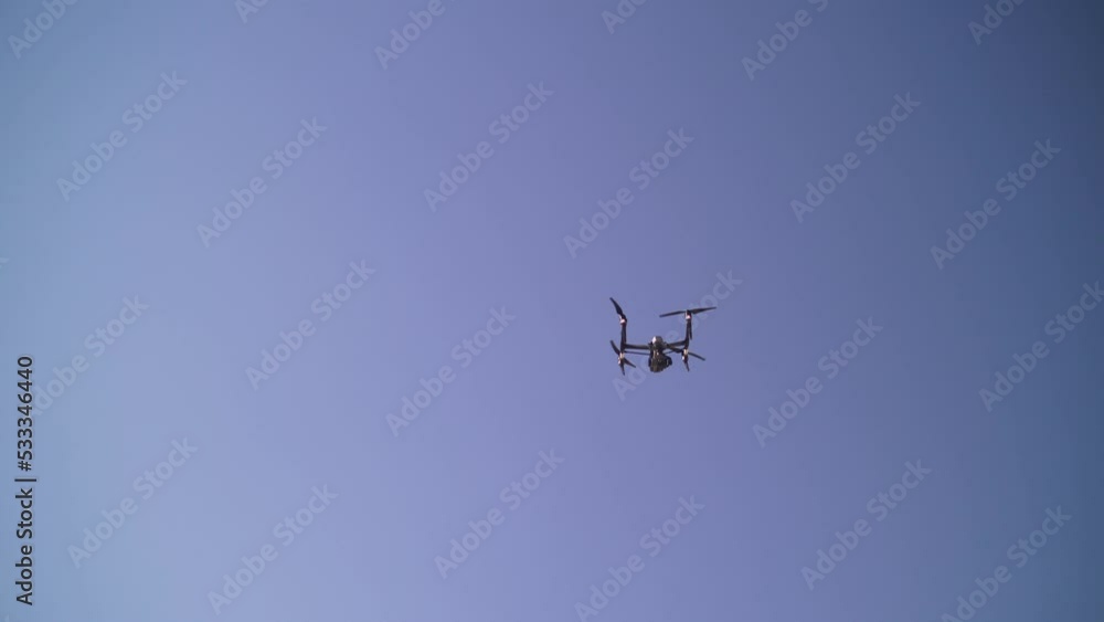 quadcopter with a camera in the air on the set of a movie. drone with a camera. filming in the desert quadcopter with a camera in the air on the set of a movie. drone with a camera. filming in the desert