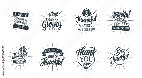 The set of lettering phrases Thanksgiving day with rays