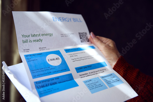 Close Up Of Senior Woman Opening UK Energy Bill Concerned About Cost Of Living Energy Crisis