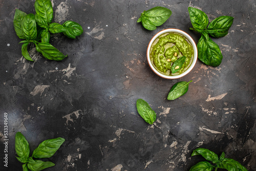 Fresh Italian pesto sauce with basil, pine nuts, parmesan cheese. Long banner format. top view