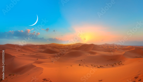 Beautiful sand dunes in the Sahara desert with crescent moon at sunrise - Sahara  Morocco