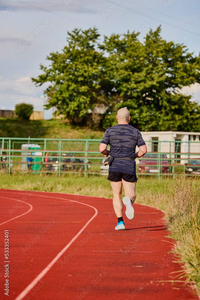 A man running on a running track