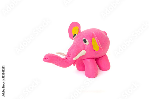 Cute elephant plasticine sculpture  pink body on white background. Handmade clay plasticine
