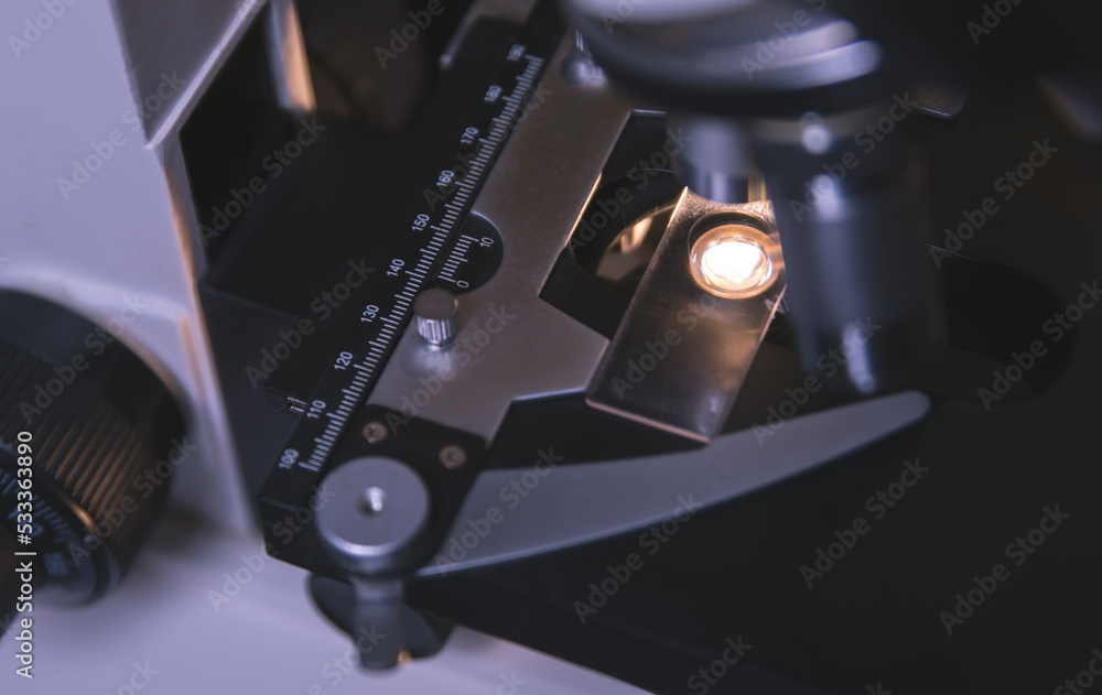 Close-up view of scientific microscopic data analysis in laboratory. Scientists research and develop medical drugs. Close-up view of scientific microscopic data analysis in laboratory. Scientists research and develop medical drugs.