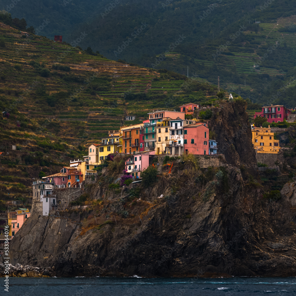 Typical Colorful Houses, Town of Manarola from the Mediterranean Sea on boat, Cinque Terre Liguria Italy