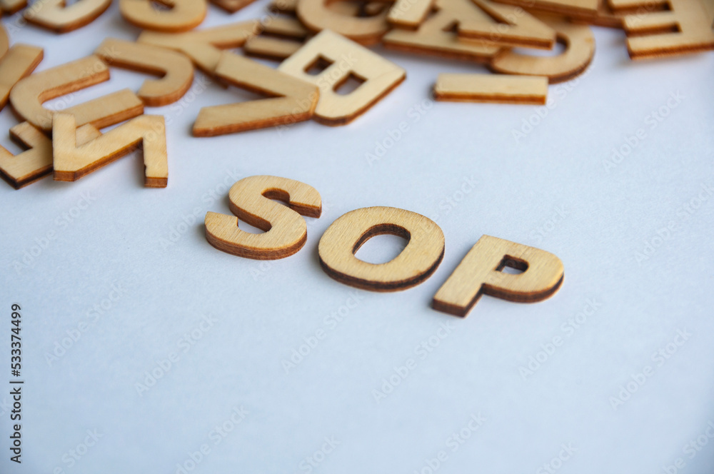 Standard operating procedures wooden text on while cover background. Social distancing concept Standard operating procedures wooden text on while cover background. Social distancing concept