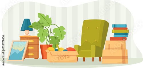 Preparing stuff belongings for moving or garage sale. Pile of stacked cardboard boxes of packed things, toys, furniture, books, lamp, houseplant. Moving to new house concept