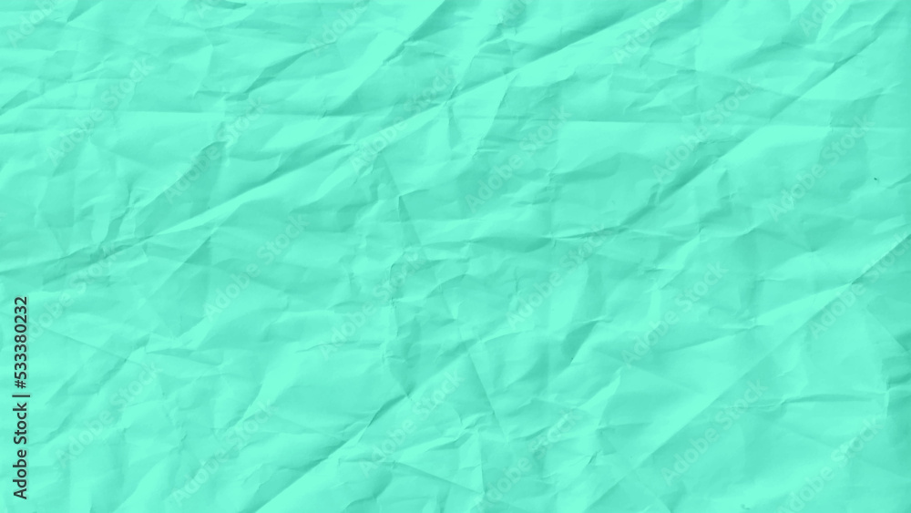 Green tone crumpled paper abstract background. Close-up fragment of a green crumpled paper texture as a backdrop composition