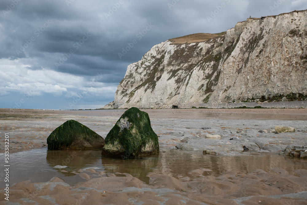 low tide on the beach of cap blanc nez in france with the white chalk cliffs low tide on the beach of cap blanc nez in france with the white chalk cliffs