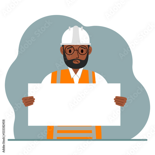 Engineer man holding a blank sheet of paper. The concept of a builder, engineer, planner or designer.