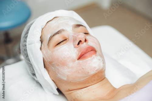 A cosmetologist does facial care and apply a face mask. cleansing a heavily soiled face. acne on the skin. skin rashes. mechanical face painting.
