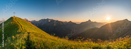 Stunning sunset hike from the top in the austria mountain photo