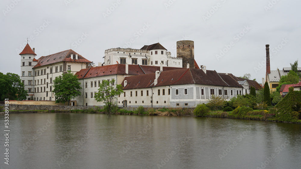 Jindrichuv Hradec Castle and Chateau, beautiful landmark towering above pond, popular tourist destination