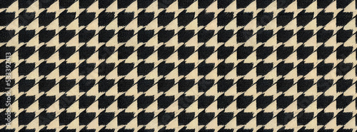 Houndstooth pattern with linen or cotton fabric texture. Black and white textile pattern for fashion and clothing design.