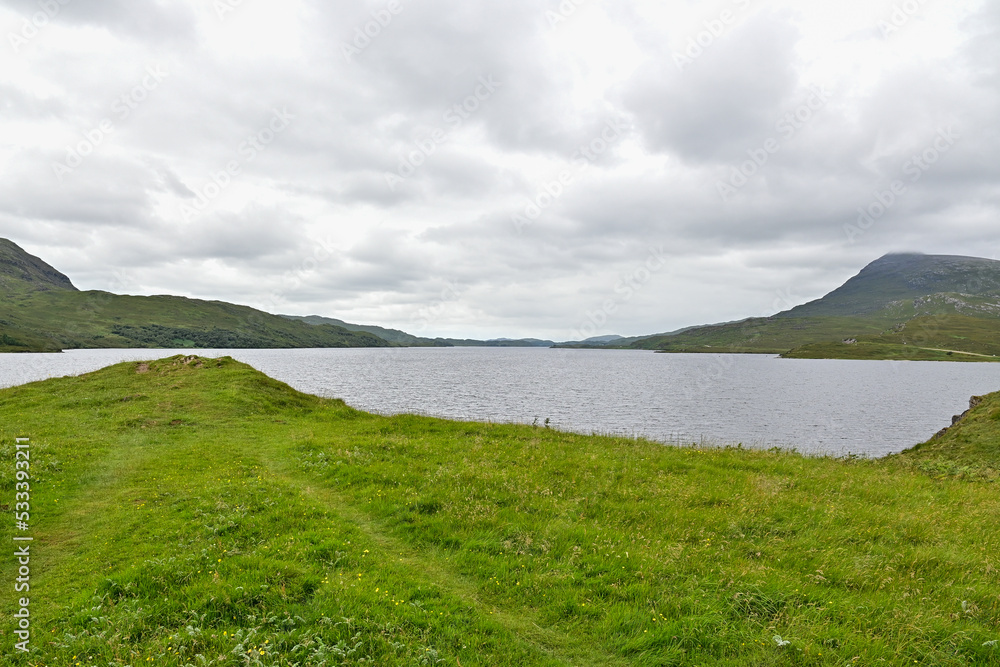 View of Loch Assynt at Inchnadamph with mountains beyond, Lairg, Highland, Scotland