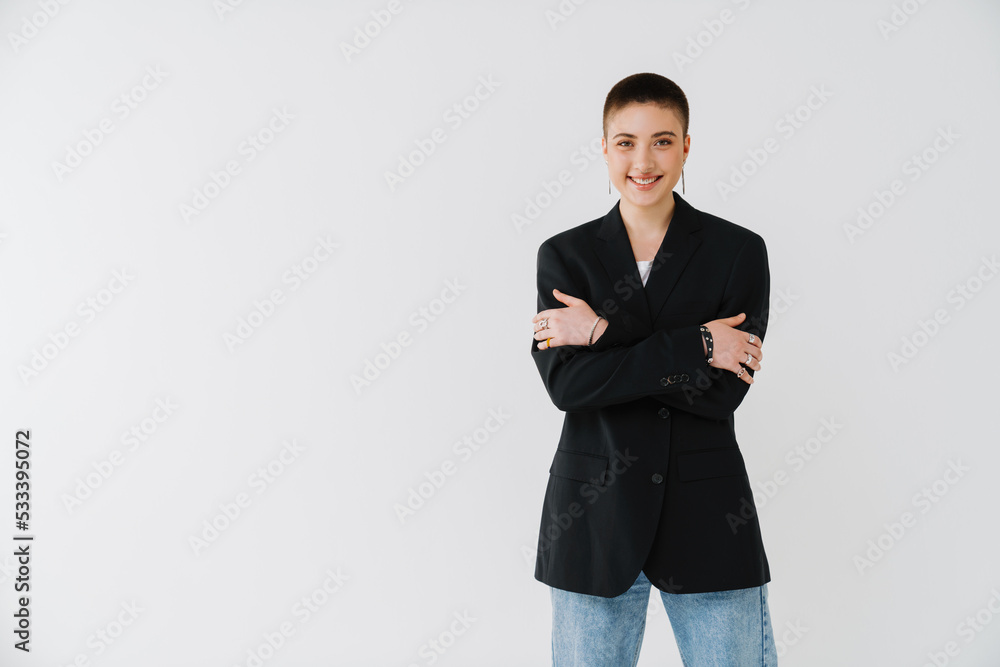 Young woman wearing jacket smiling and looking at camera Young woman wearing jacket smiling and looking at camera