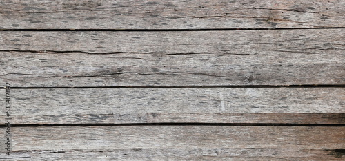 Pattern of old wooden floor Horizontal image of small wooden planks with different patterns stacked together to form a fence, bridge. or furniture 