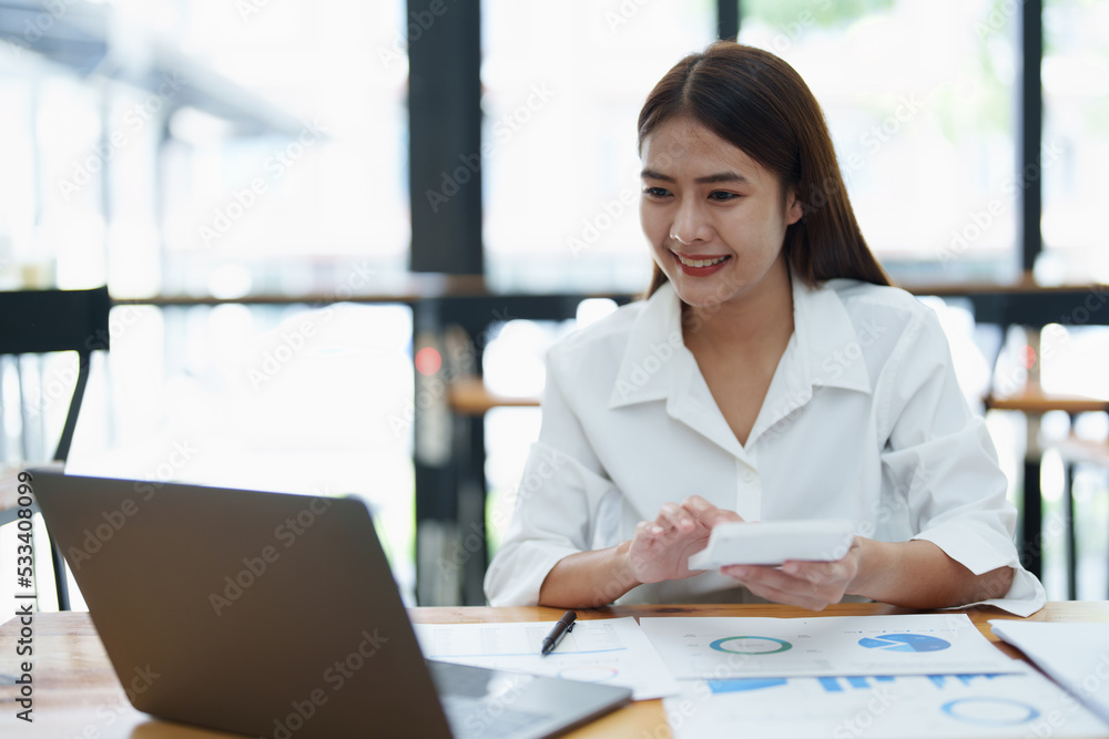 Accountants are reviewing financial budget documents and using annual income tax calculators to submit them to the IRS Accountants are reviewing financial budget documents and using annual income tax calculators to submit them to the IRS