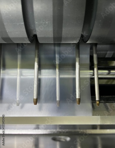 Air nozzle of plastic film servo type cutting machine with rubber feeding roller.