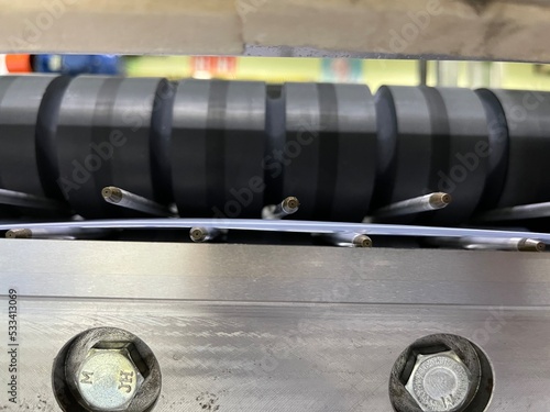 Air nozzle of plastic film servo type cutting machine with rubber feeding roller.
