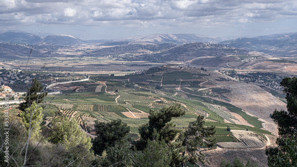 Obraz premium View of Southern Labanon villages Marjayoun, Al Qulayah, Al Khiyam, Kafr Kla, Kafr Shuba, Al Ghajr with Metula as seen from Mitzpe Benya lookout, located at the foot of Misgav Am, Upper Galilee,Israel